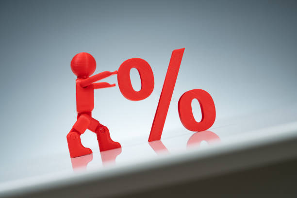 Close-up Of A Red Human Character Pushing Up A Percentage Symbol On A Grey Background