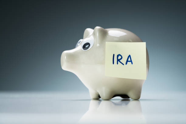 istock Piggy Bank On A Desk With Ira Text 1188463075