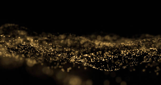istock Golden glitter splash, light particles wave, golden sparks glow. Glittering light bokeh on black background, overlay effect 1188464200