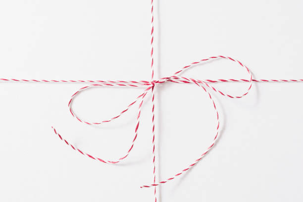 istock White Red Christmas Rope Bow on the White Background. 1188464252