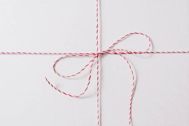 istock White Red Christmas Rope Bow on the White Background. 1188464401