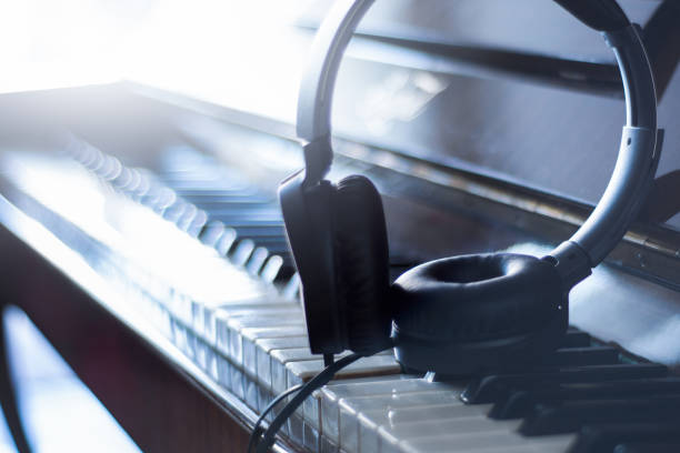 istock headphones on piano keys 1188464545