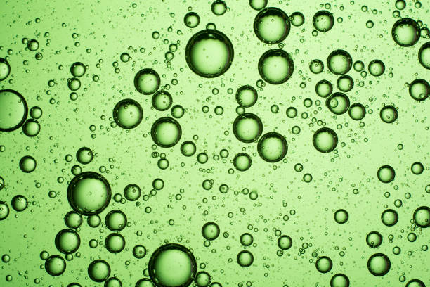 istock light green oil bubbles on the water 1188464679