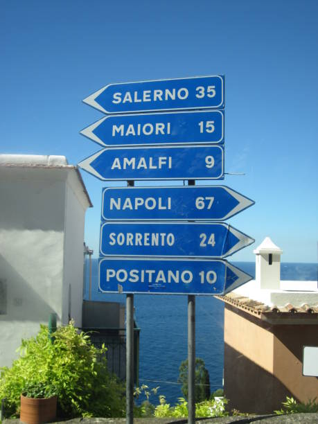 Traffic signs Traffic signs with different places in Amalfi Coast (Salerno, Maiori, Amalfi, Napoli and Positano) amalfi food stock pictures, royalty-free photos & images