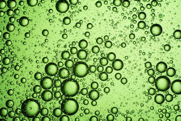 istock light green oil bubbles on the water 1188468226