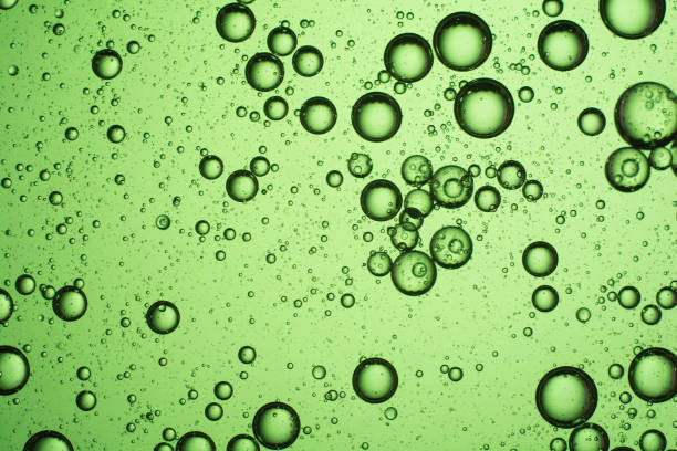 istock light green oil bubbles on the water 1188469384