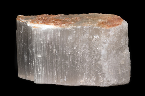 Selenite (or satin spar) mineral from Spain isolated on a pure black background