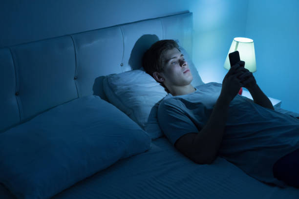 istock Tired and stressed on bed at night 1188472491
