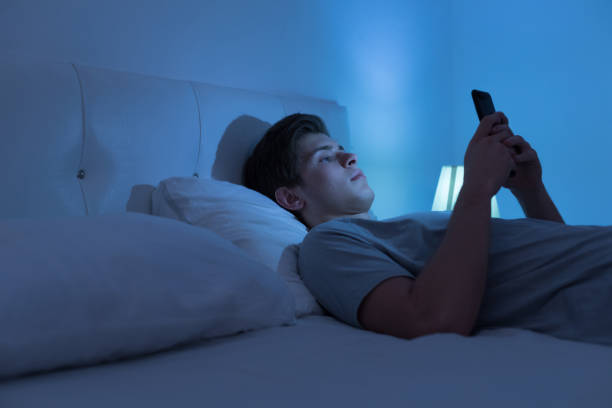 istock Tired and stressed on bed at night 1188472620
