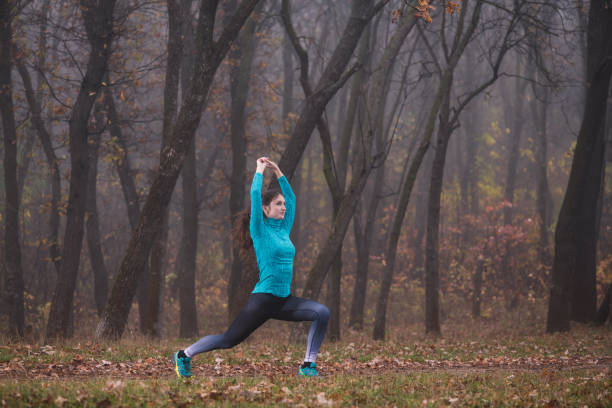 istock Woman make squat lunge with hand up 1188475209