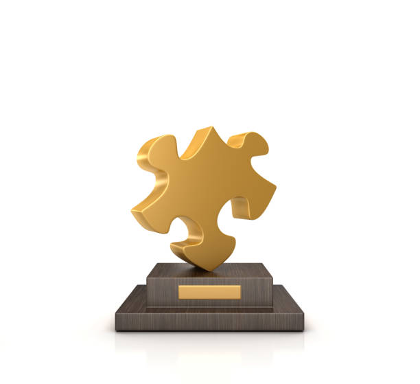 trophäe mit puzzle-stück - 3d-rendering - puzzle part of gold jigsaw piece stock-fotos und bilder