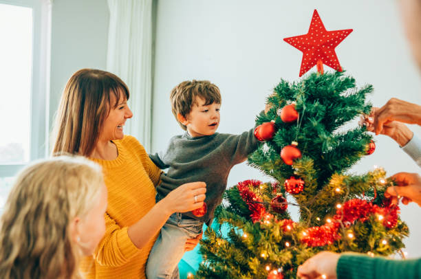 istock Family decorating the Christmas tree 1188478811