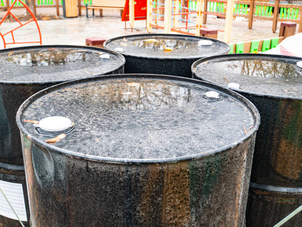 istock Black iron industrial barrels for liquids. 1188480147