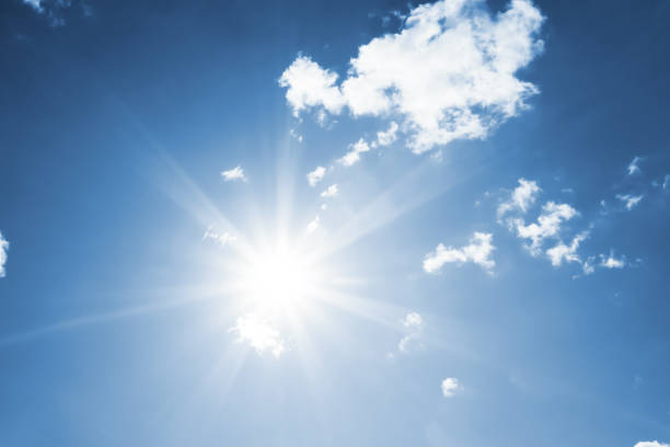 istock Bright sun with beautiful beams in the sky with clouds 1188480294
