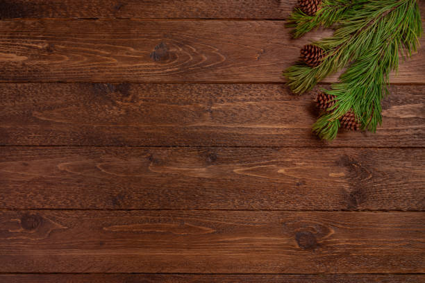 istock Minimal Christmas composition. Spruce branches with cones, on dark, wooden  background. Christmas, winter concept. Flat lay, top view. 1188480823