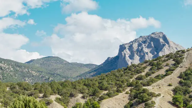 Photo of Summer view of mountain Sokol in the clouds.