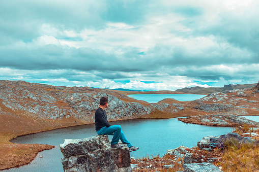 Man contemplating the beauty of nature in a lagoon of high Peru Cajamarca