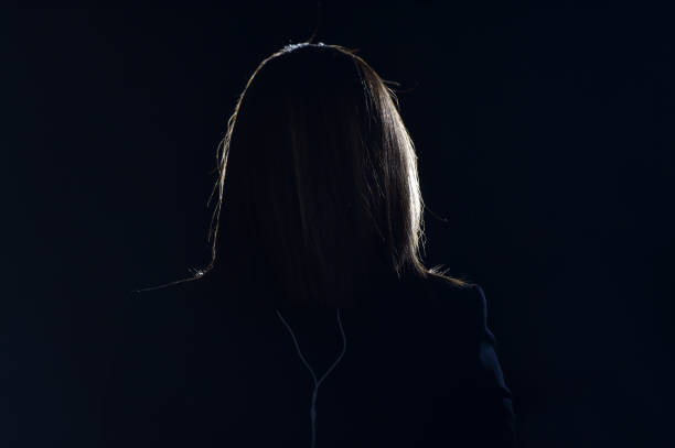 istock Journalist making a live broadcast in front of a spotlight 1188486543