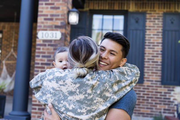 istock Excited husband is happy to see his solder wife's return 1188487407