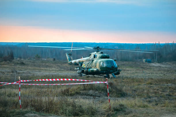 istock Military helicopter stands at the war field 1188490809