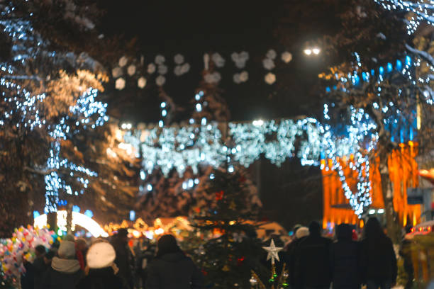 istock garland blurred lights background with orange and green colors 1188490813