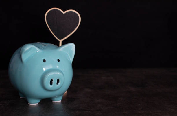 istock Heart shaped chalkboard with piggy bank 1188490878