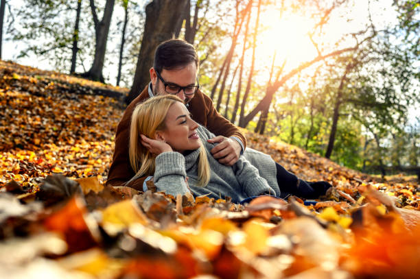 istock Romantic couple in autumn park 1188492773