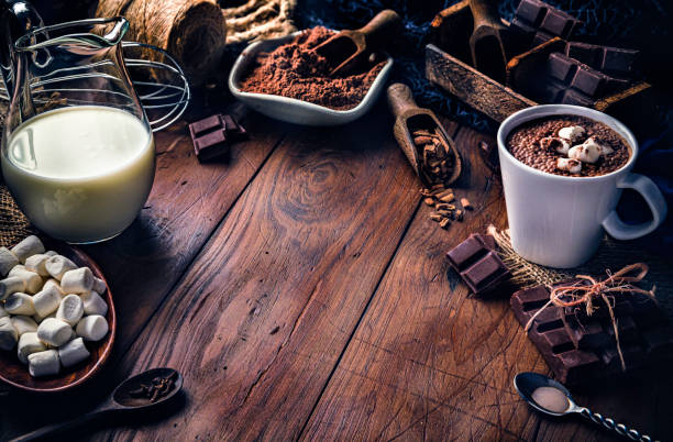 istock Christmas table setup with homemade chocolate mug, marshmallows on rustic table 1188493709