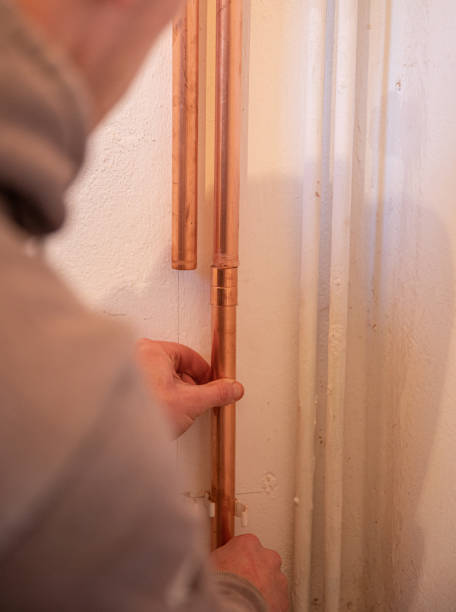 istock Plumber fixing jointing copper pipework in a residential home. 1188497086