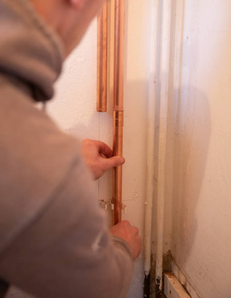 istock Plumber fixing jointing copper pipework in a residential home. 1188497228