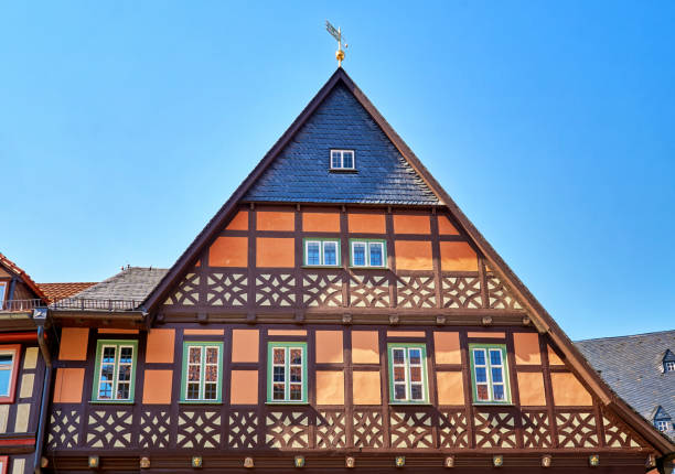 istock Old half-timbered house with small windows and shingle roof. 1188497291