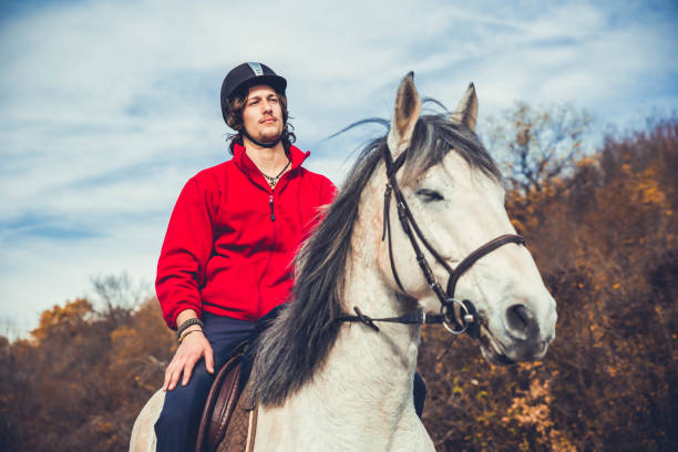 istock Man riding a white horse 1188498922
