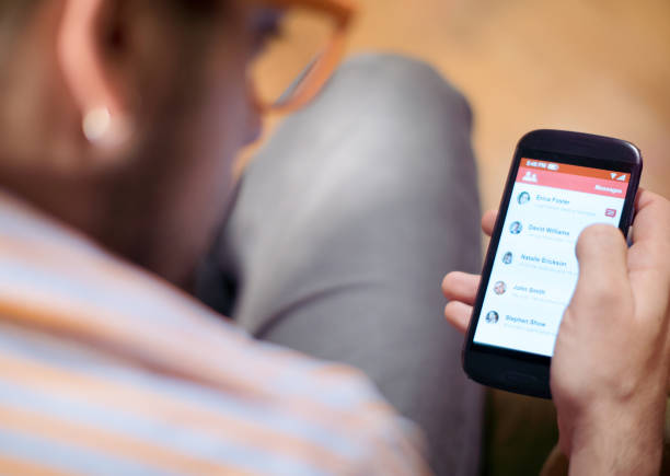 istock Man obsessed with his social media, focus on smartphone 1188502222
