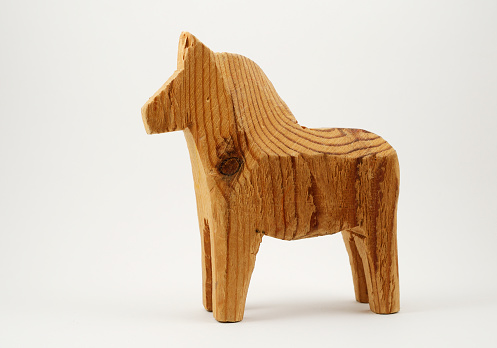 traditional wooden toy horse on a white background