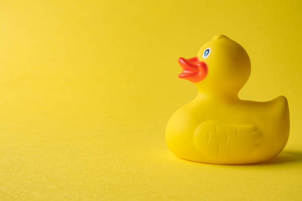 istock Rubber duck on yellow background minimal creative concept. Space for copy. 1188505243