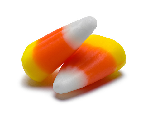 Two Pieces of Candy Corn Isolated on White Background.