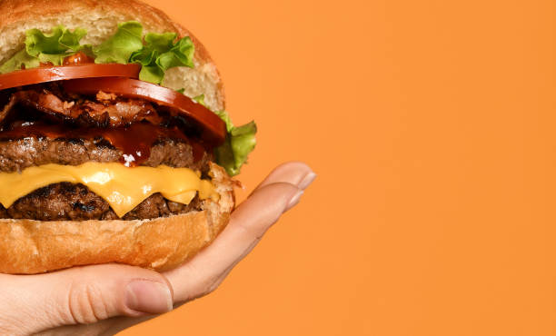 istock Close up big cheeseburger barbeque sandwich with marble beef on yellow 1188509269