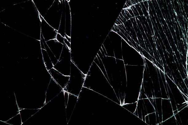 istock cracked glass isolated on a black background. 1188510170