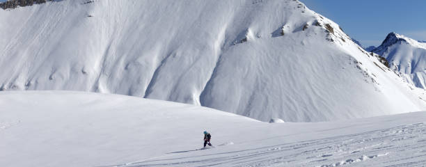 istock Snowboarder downhill on off piste slope with newly-fallen snow 1188510330