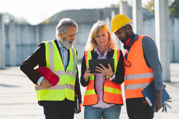 istock A team of multi ethnic construction workers in reflective vests 1188510406