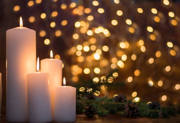istock Tree branches, cones, bokeh lights, candles. Preparation for the New Year 1188510604