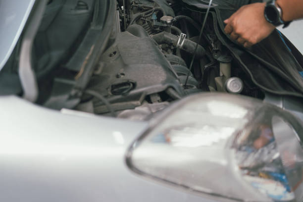 istock technician checking motor oil level for maintenance car engine 1188510608