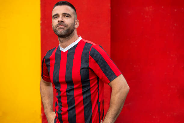 istock Man in sport outfit standing on color background 1188510765
