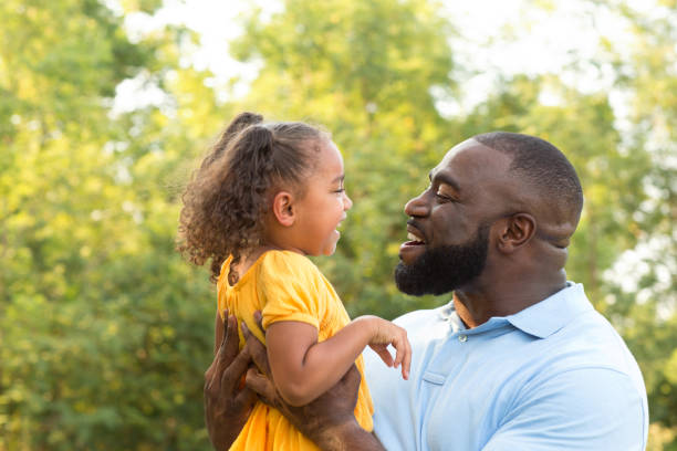 istock Father laughing and playing with his daugher. 1188511570