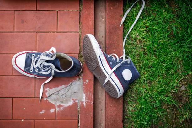 Urban sneakers seen from above in a grassy courtyard