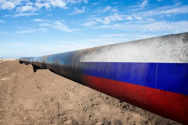 Concept of natural gas distribution through pipes with Russian flag on it.