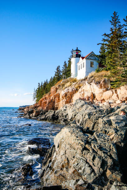 The Bass Harbor Head Lighthouse in Maine An autumn view of the Bass Harbor Head Lighthouse in Acadia National Park in Bar Harbor, Maine acadia national park maine stock pictures, royalty-free photos & images