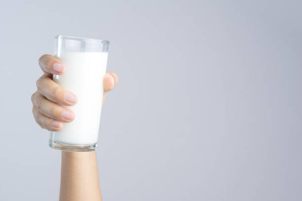 istock Hand holding a Glass of fresh milk 1188515550