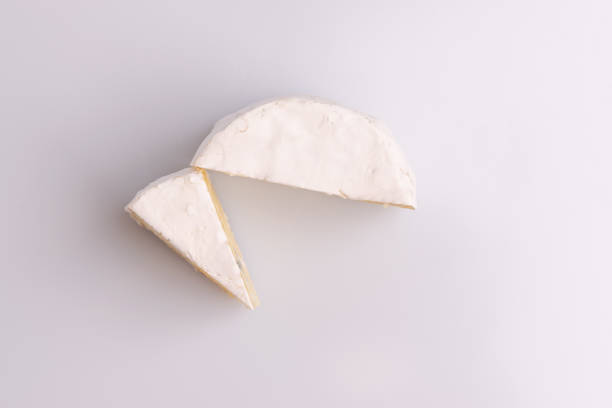 istock Blue cheese with white surface, isolated on white background, soft light, studio photo. Mix of gorgonzola and camembert / brie cheese. 1188516320