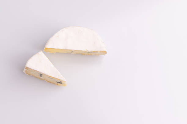 istock Blue cheese with white surface, isolated on white background, soft light, studio photo. Mix of gorgonzola and camembert / brie cheese. 1188516343
